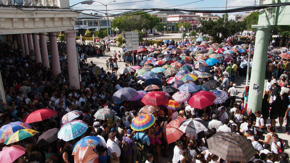 Crowds in the midday sun wait to say Farewell to Fidel